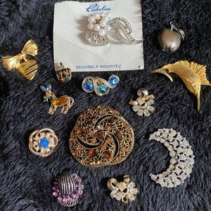 Vintage broken brooches and earrings.